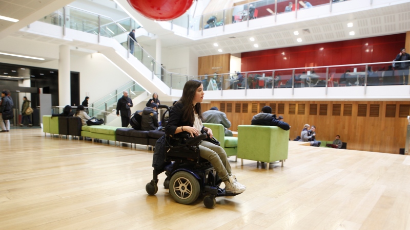 A wheelchair user in the New Academic Building