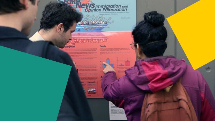 students-looking-at-event-poster