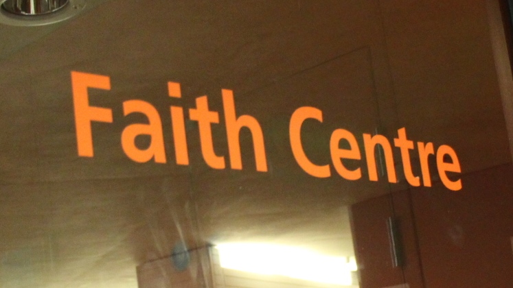 Faith Centre orange label on Faith Centre door.
