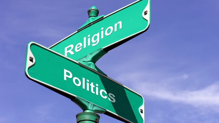 Religion and Politics intersecting road sign.