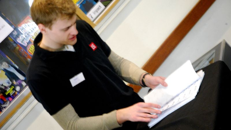 an LSE staff member sorting documents
