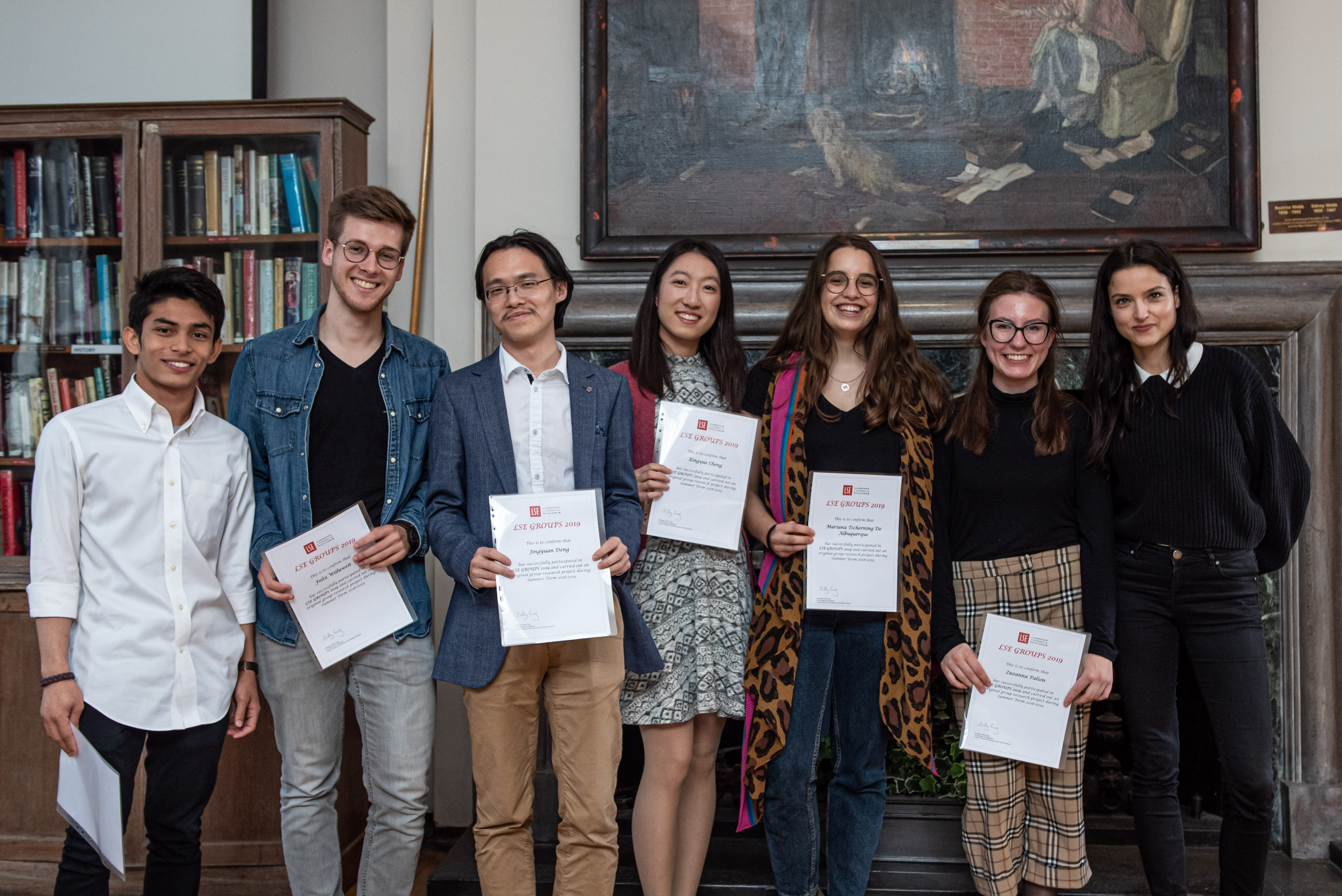 Angela and her research group receive their certificates