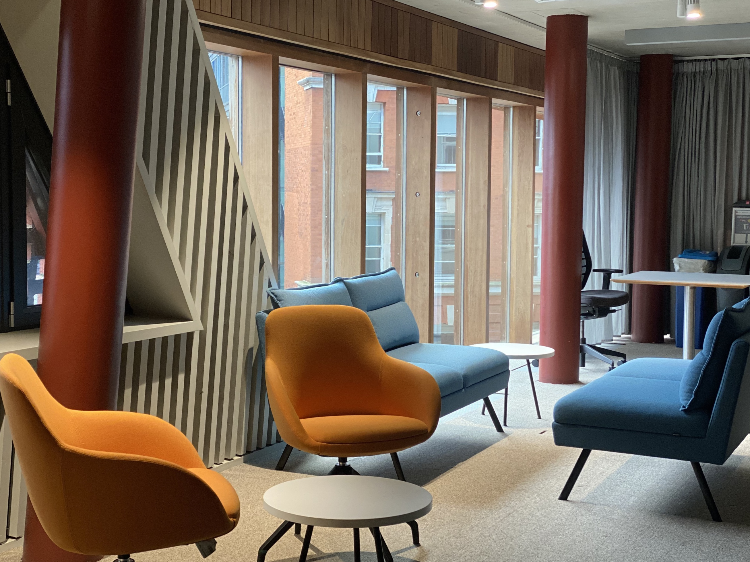 A close-up of the furniture in the Community Space, next to the windows