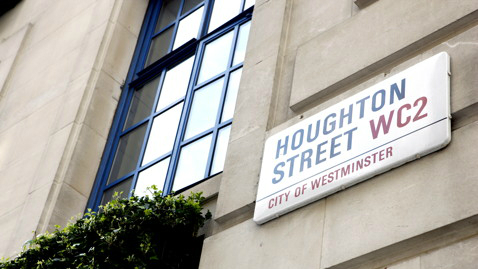 The sign for Houghton Street on the side of a building