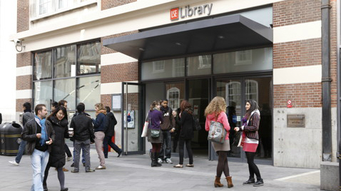 Students gather and chat outside the LSE Library